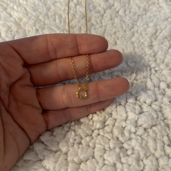 Dainty gold necklace with simple circle and singular diamond. - Picture 2 of 4